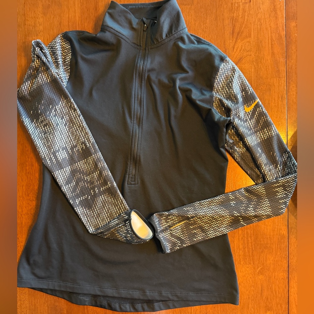 Nike Black, gray and Gold accent Patterned 1/2 zip top.